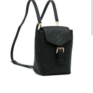 Pre loved- in great condition. Authentic Louis Vuitton miniature backpack.